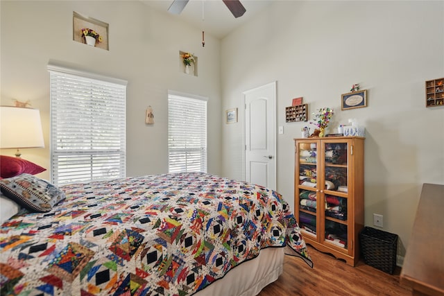 2209 Parker Ct, Brenham, TX 77833 - bedroom featuring wood finished floors, ceiling fan, and a towering ceiling