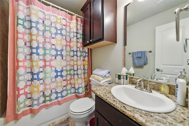 2209 Parker Ct, Brenham, TX 77833 - bathroom featuring vanity, shower / bath combo, and toilet