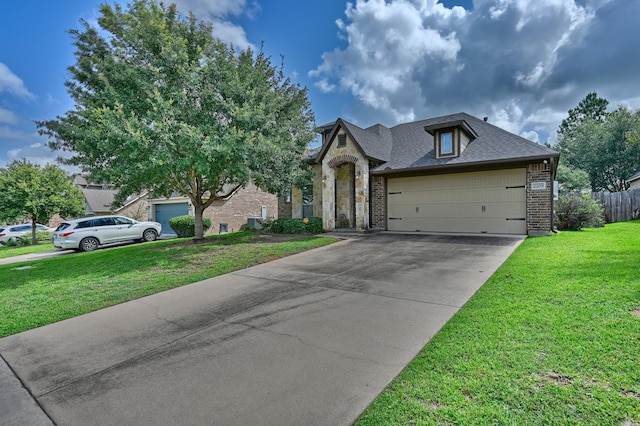 2209 Parker Ct, Brenham, TX 77833 - view of front of home featuring brick siding, driveway, and an attached garage