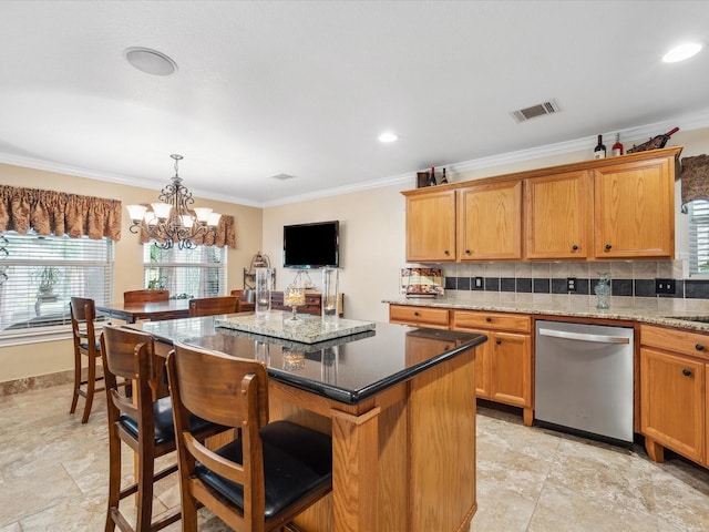 136 Fantail St, Magnolia, TX 77355 - kitchen with dishwasher, crown molding, a chandelier, a kitchen island, and a breakfast bar
