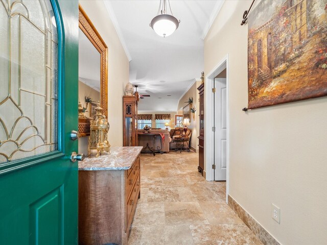 136 Fantail St, Magnolia, TX 77355 - entryway featuring ornamental molding, baseboards, stone finish flooring, and ceiling fan