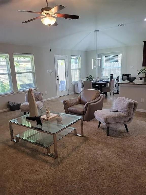 17023 Tallgrass Prairie Ln, Humble, TX 77346 - living room featuring baseboards, light colored carpet, and a ceiling fan