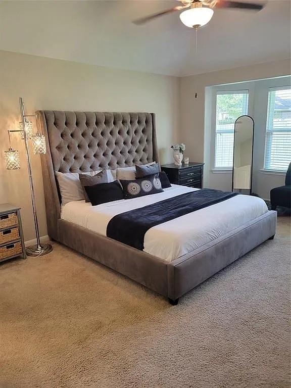 17023 Tallgrass Prairie Ln, Humble, TX 77346 - carpeted bedroom featuring a ceiling fan