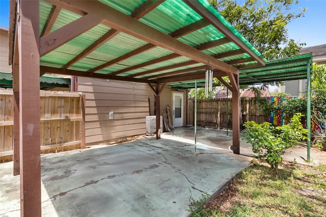 2616 45th St, Galveston, TX 77550 - view of patio / terrace featuring a carport