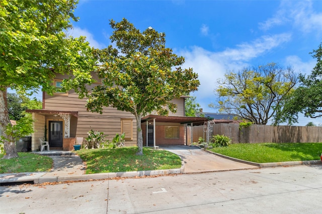 2616 45th St, Galveston, TX 77550 - view of front facade with driveway and a carport