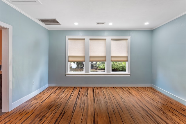 2616 45th St, Galveston, TX 77550 - spare room featuring baseboards, ornamental molding, wood finished floors, and recessed lighting