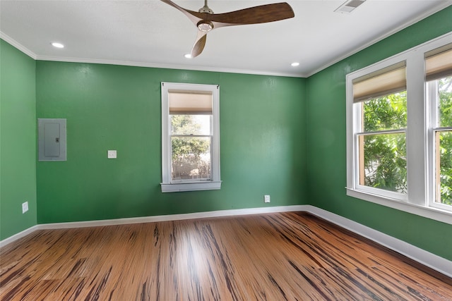 2616 45th St, Galveston, TX 77550 - spare room featuring electric panel, healthy amount of natural light, ornamental molding, baseboards, and recessed lighting