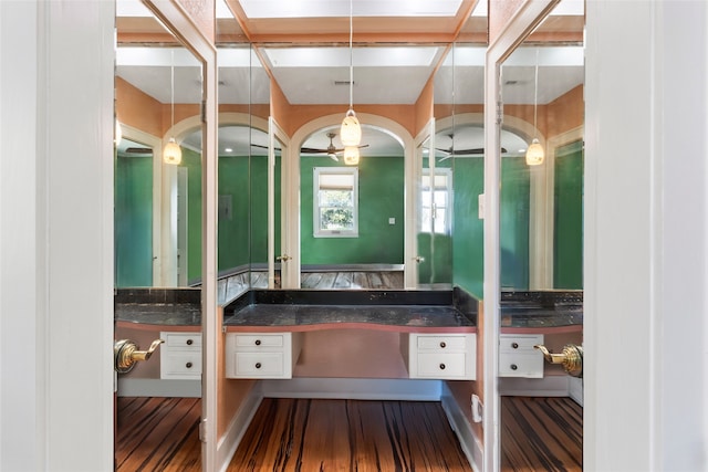 2616 45th St, Galveston, TX 77550 - bathroom featuring vanity and wood finished floors