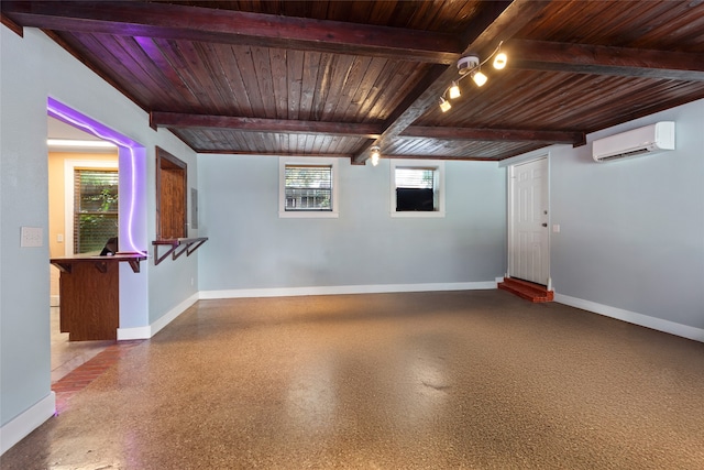 2616 45th St, Galveston, TX 77550 - unfurnished room with wooden ceiling with exposed beams, a wall mounted AC, and baseboards