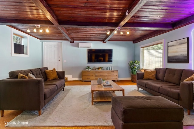 2616 45th St, Galveston, TX 77550 - living room with wooden ceiling with exposed beams and an AC wall unit