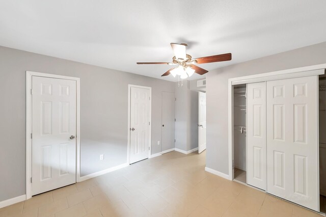 12633 Memorial Dr Unit 179, Houston, TX 77024 - unfurnished bedroom featuring baseboards and ceiling fan
