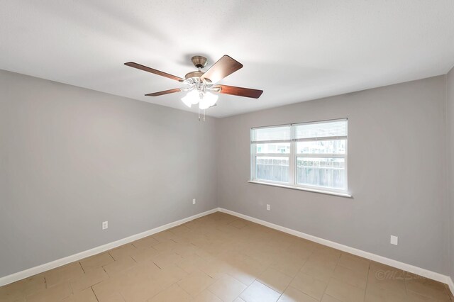 12633 Memorial Dr Unit 179, Houston, TX 77024 - empty room featuring a ceiling fan and baseboards