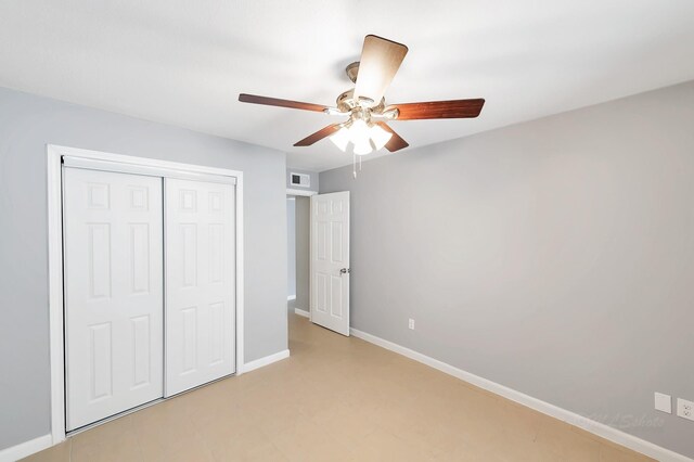 12633 Memorial Dr Unit 179, Houston, TX 77024 - unfurnished bedroom featuring a closet, baseboards, and a ceiling fan