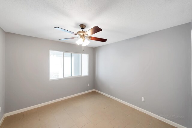 12633 Memorial Dr Unit 179, Houston, TX 77024 - spare room featuring ceiling fan, baseboards, and a textured ceiling