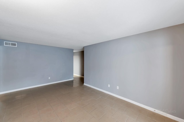 12633 Memorial Dr Unit 179, Houston, TX 77024 - tiled spare room with baseboards