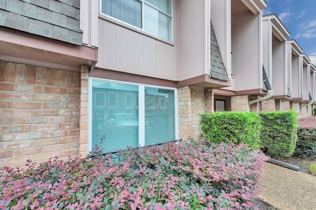 12633 Memorial Dr Unit 179, Houston, TX 77024 - view of side of property with brick siding