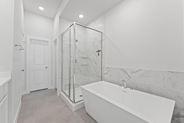 16514 Lake Austin St, Cypress, TX 77433 - bathroom with a soaking tub, a marble finish shower, vanity, and recessed lighting
