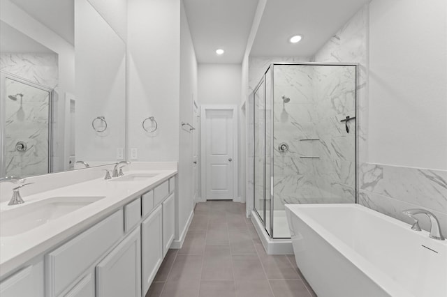 16514 Lake Austin St, Cypress, TX 77433 - bathroom with a freestanding tub, a marble finish shower, double vanity, recessed lighting, and tile patterned flooring