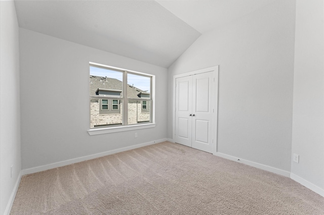 16514 Lake Austin St, Cypress, TX 77433 - unfurnished bedroom featuring carpet, vaulted ceiling, and a closet