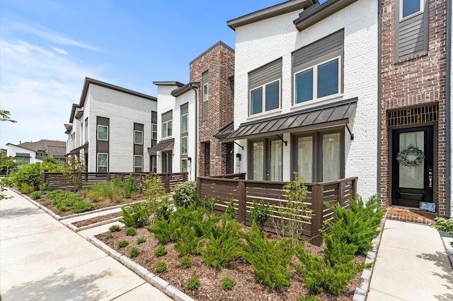 16514 Lake Austin St, Cypress, TX 77433 - view of front of property with brick siding and a standing seam roof