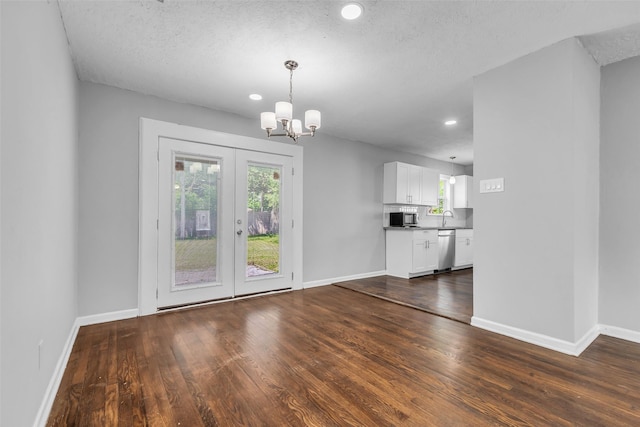 2032 Vince St, Pasadena, TX 77502 - unfurnished dining area with dark wood finished floors, a chandelier, baseboards, a sink, and recessed lighting