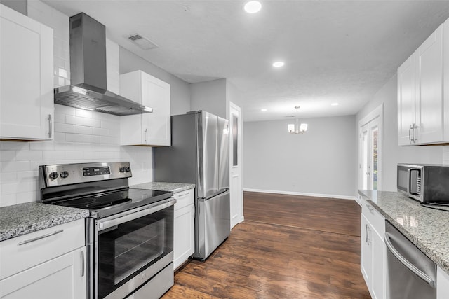 2032 Vince St, Pasadena, TX 77502 - kitchen featuring appliances with stainless steel finishes, wall chimney exhaust hood, recessed lighting, baseboards, and decorative backsplash