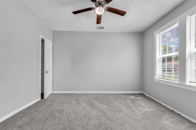 2032 Vince St, Pasadena, TX 77502 - carpeted empty room with a textured ceiling, plenty of natural light, ceiling fan, and baseboards