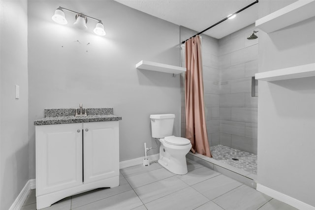 2032 Vince St, Pasadena, TX 77502 - full bathroom featuring a tile shower, toilet, vanity, and baseboards