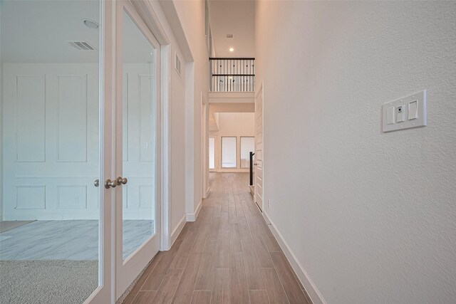30351 Spragletop View St, Brookshire, TX 77423 - hall featuring wood finished floors, baseboards, and a textured wall