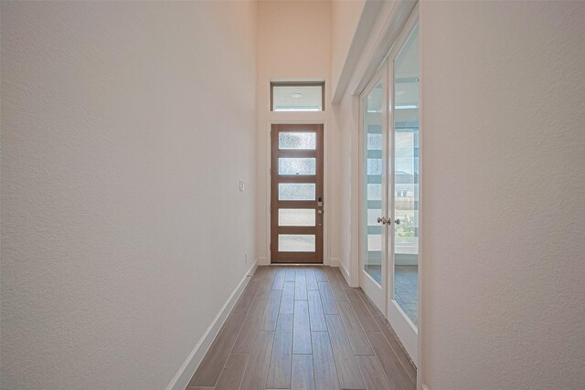 30351 Spragletop View St, Brookshire, TX 77423 - doorway with a textured wall, dark wood-style floors, french doors, and baseboards