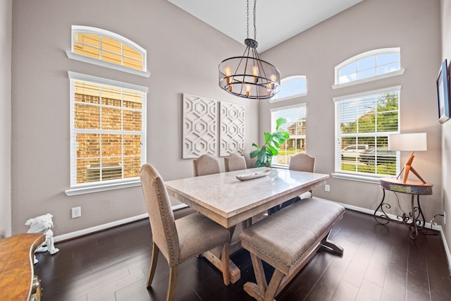 13526 Astley Acres Ln, Cypress, TX 77429 - dining area featuring a chandelier, dark wood finished floors, baseboards, and high vaulted ceiling