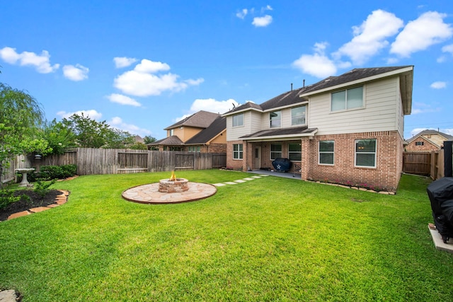 13526 Astley Acres Ln, Cypress, TX 77429 - back of house with brick siding, an outdoor fire pit, and a patio area