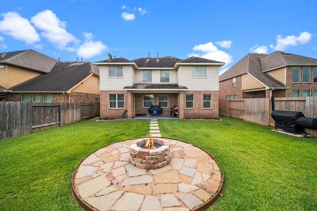 13526 Astley Acres Ln, Cypress, TX 77429 - rear view of house with brick siding, a patio, and a fire pit