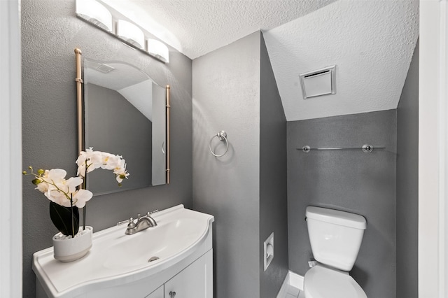 20234 Brondesbury Dr, Katy, TX 77450 - half bath featuring toilet, vanity, and a textured ceiling