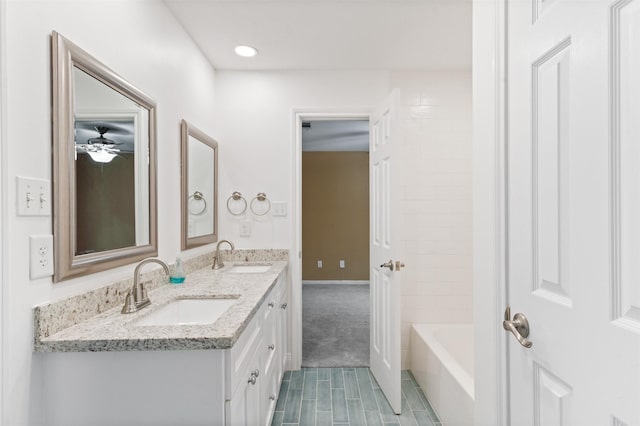 20234 Brondesbury Dr, Katy, TX 77450 - full bathroom featuring double vanity, recessed lighting, ceiling fan, and wood finished floors