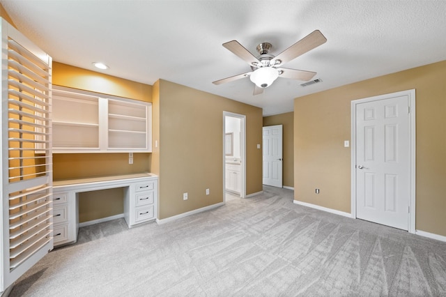 20234 Brondesbury Dr, Katy, TX 77450 - unfurnished office with ceiling fan, light carpet, built in study area, and baseboards