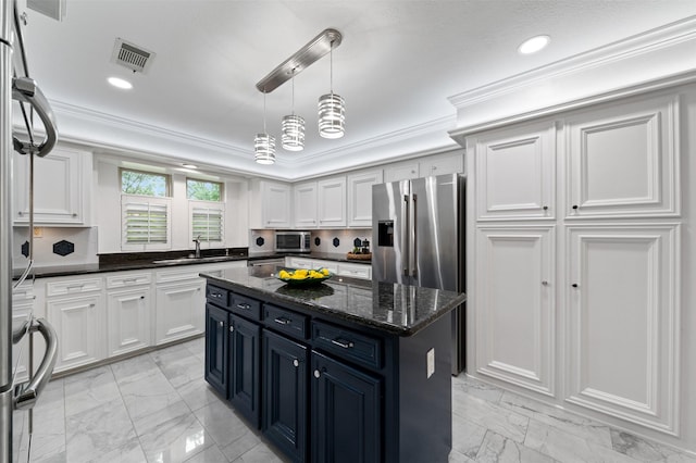 20234 Brondesbury Dr, Katy, TX 77450 - kitchen featuring a sink, light marble finish flooring, stainless steel appliances, white cabinetry, and ornamental molding