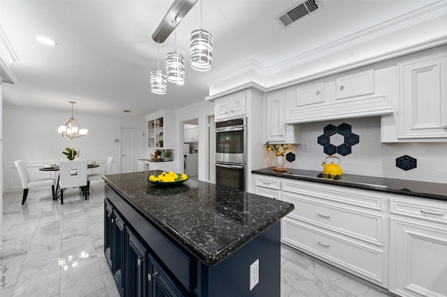 20234 Brondesbury Dr, Katy, TX 77450 - kitchen with a chandelier, stainless steel double oven, black electric cooktop, light marble finish flooring, and ornamental molding
