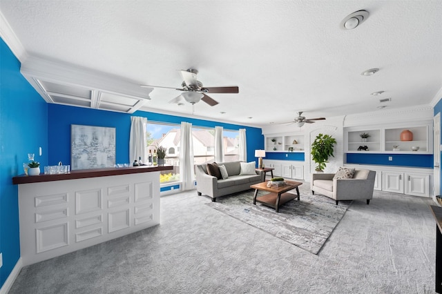 20234 Brondesbury Dr, Katy, TX 77450 - living room featuring carpet flooring, a textured ceiling, ornamental molding, ceiling fan, and attic access