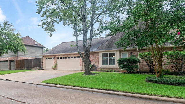 20234 Brondesbury Dr, Katy, TX 77450 - view of front of home featuring a garage, driveway, brick siding, and roof with shingles
