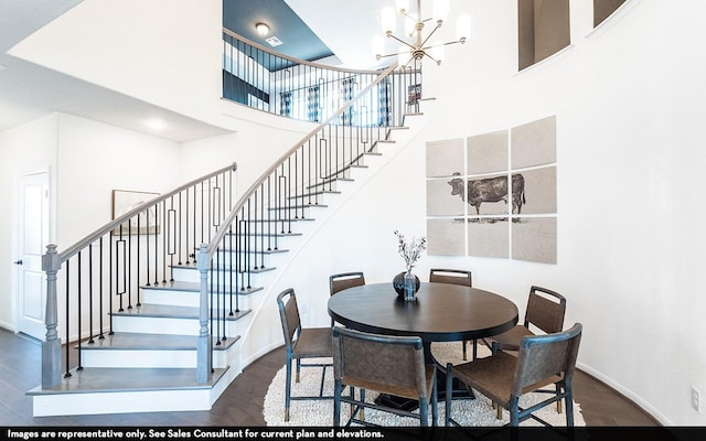 12106 Hollow Marsh Dr, Santa Fe, TX 77510 - dining room featuring a towering ceiling, stairway, dark wood-style floors, a chandelier, and baseboards