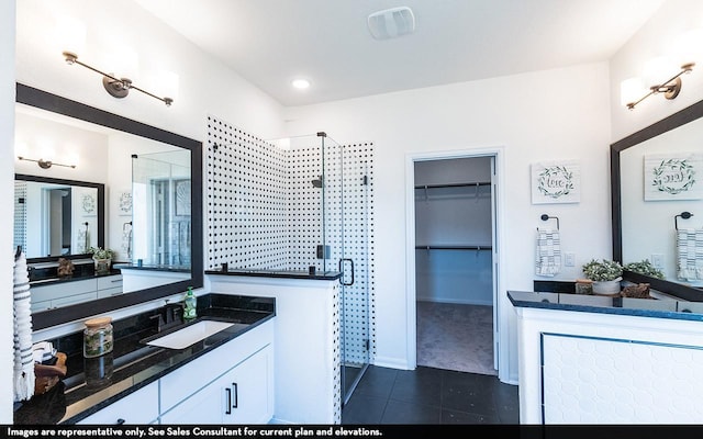 12106 Hollow Marsh Dr, Santa Fe, TX 77510 - bathroom with tile patterned flooring, a shower stall, vanity, and a walk in closet