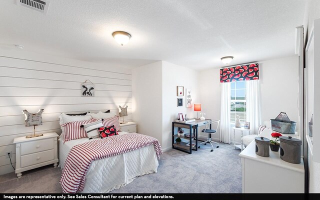 12106 Hollow Marsh Dr, Santa Fe, TX 77510 - carpeted bedroom featuring a textured ceiling and a desk