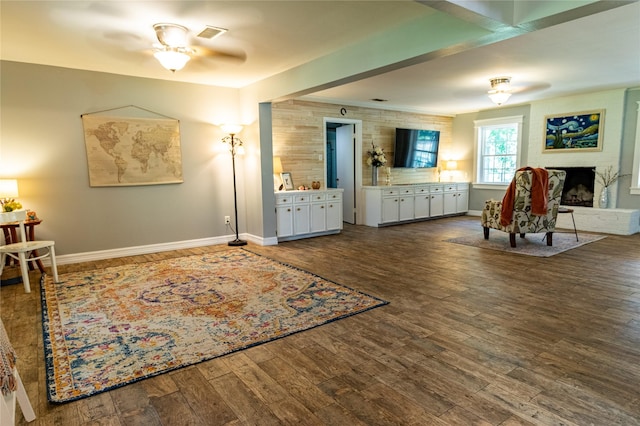 16003 Lone Shadow Trl, Stagecoach, TX 77355 - sitting room with a ceiling fan, wood finished floors, baseboards, and a brick fireplace