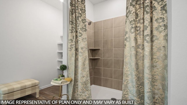 506 Belle Springs Ln, Conroe, TX 77301 - bathroom featuring a stall shower and wood finished floors