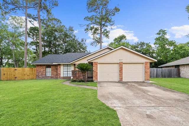 9207 Loren Ln, Houston, TX 77040 - view of front facade with brick siding, an attached garage, and driveway