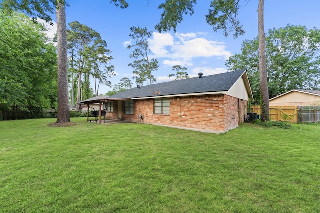 9207 Loren Ln, Houston, TX 77040 - back of house featuring a patio area, brick siding, and roof with shingles