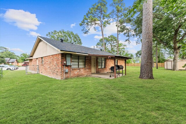 9207 Loren Ln, Houston, TX 77040 - back of house featuring a patio, brick siding, a gate, and a shingled roof