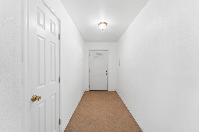 9207 Loren Ln, Houston, TX 77040 - hall with baseboards and light tile patterned floors