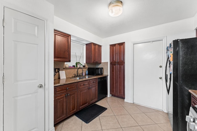9207 Loren Ln, Houston, TX 77040 - kitchen featuring black appliances, a sink, tasteful backsplash, and light tile patterned floors